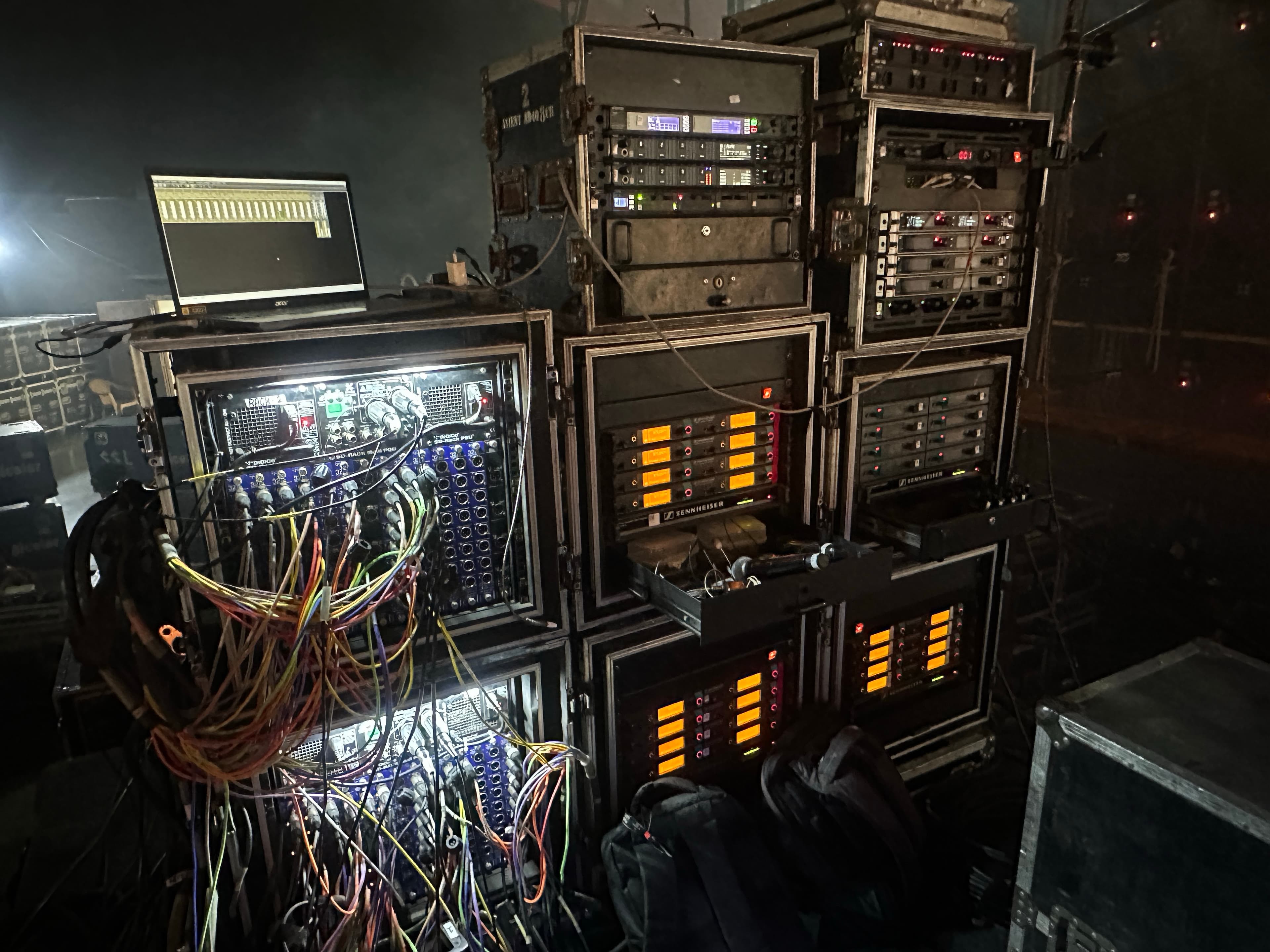 Backstage equipment racks and wireless systems.